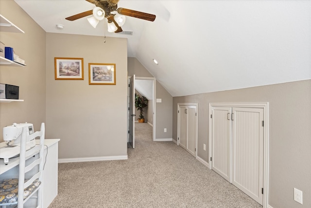 bonus room with light carpet, ceiling fan, and vaulted ceiling