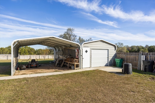 garage featuring a carport and a lawn