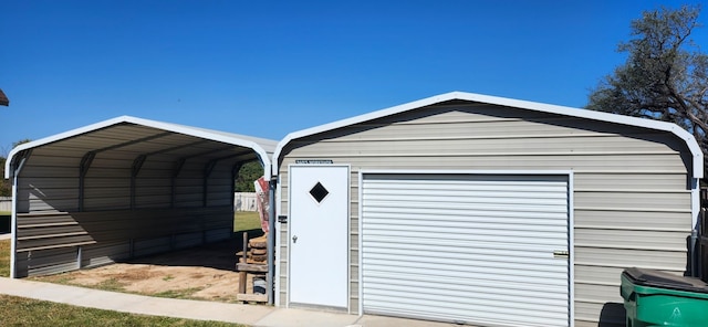 garage featuring a carport