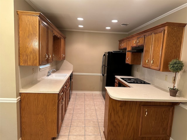 kitchen with ornamental molding, black appliances, and sink