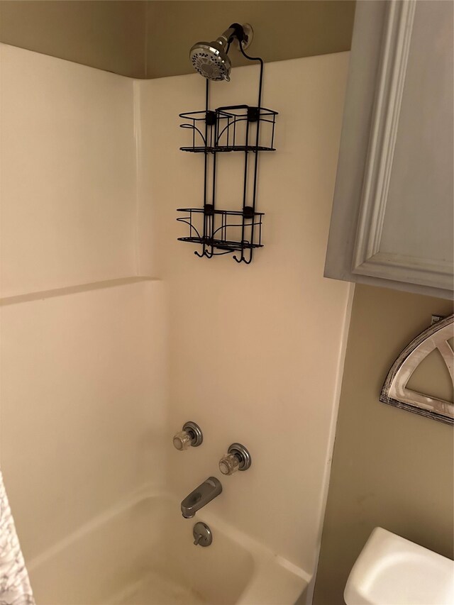 room details featuring shower / tub combination