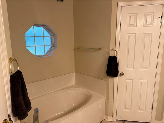 bathroom with a tub to relax in