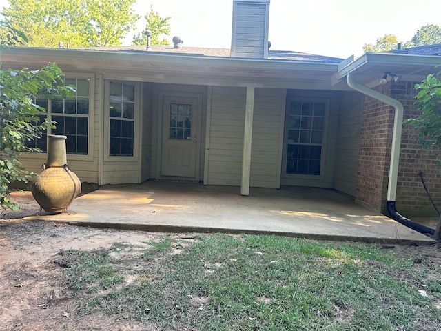 back of property featuring a patio area