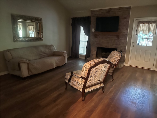 living room featuring dark hardwood / wood-style floors and a fireplace