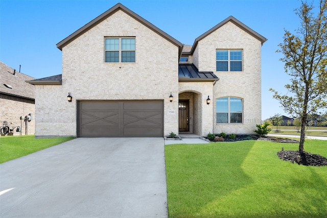 view of front of house with a garage and a front yard