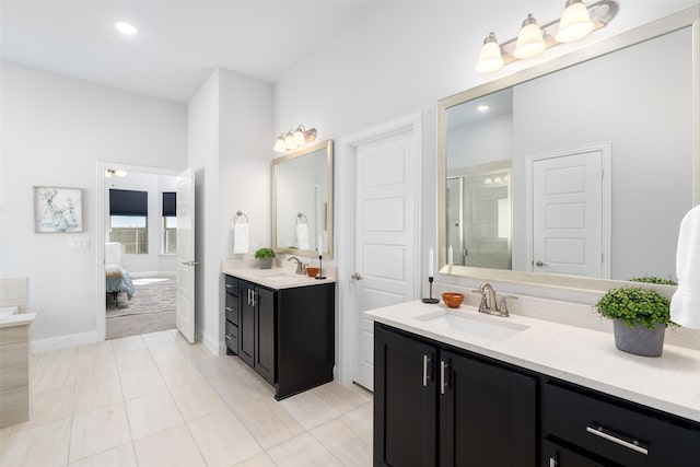 bathroom with tile patterned floors, a shower with shower door, and vanity