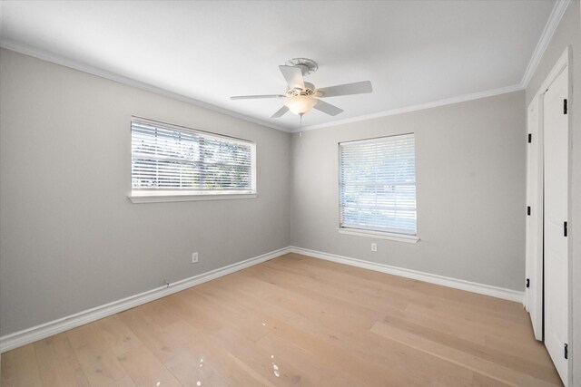 spare room with ornamental molding, light wood-type flooring, and ceiling fan