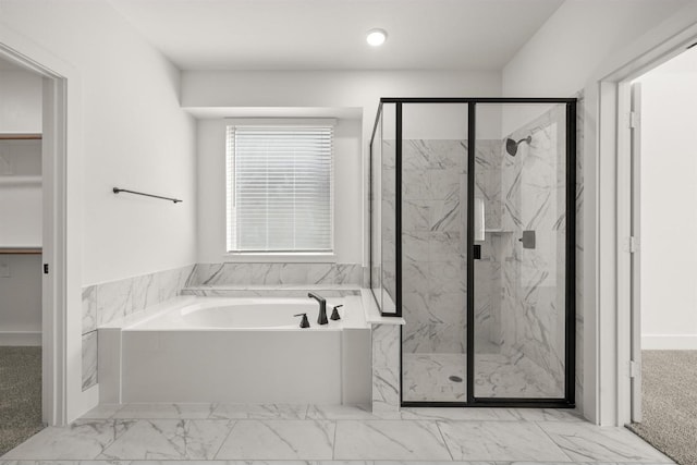 bathroom with a bath, marble finish floor, a marble finish shower, and recessed lighting