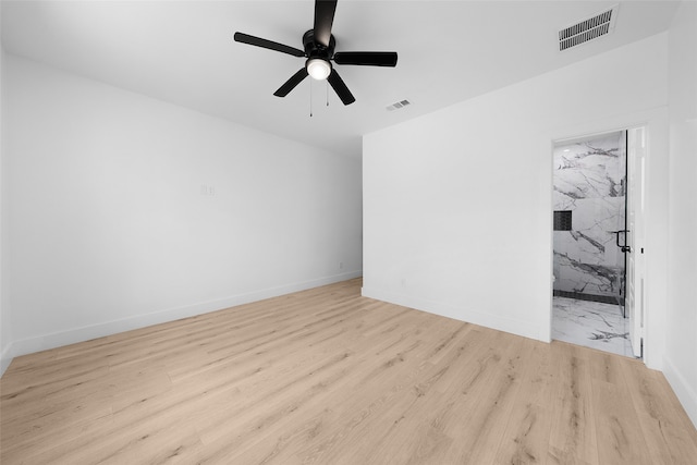 unfurnished room with ceiling fan and light wood-type flooring