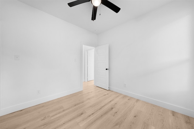 spare room featuring light wood-type flooring and ceiling fan