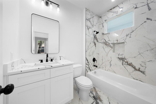 full bathroom with vanity, toilet, and tiled shower / bath