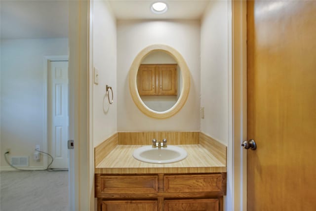 bathroom featuring visible vents and vanity