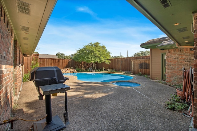 view of swimming pool with a fenced backyard, a grill, a fenced in pool, and a patio