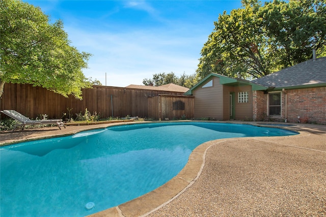 view of pool featuring a patio, a fenced backyard, and a fenced in pool