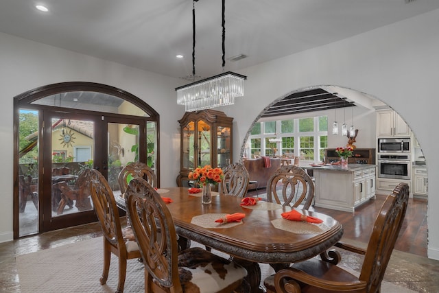 dining room featuring a chandelier and french doors