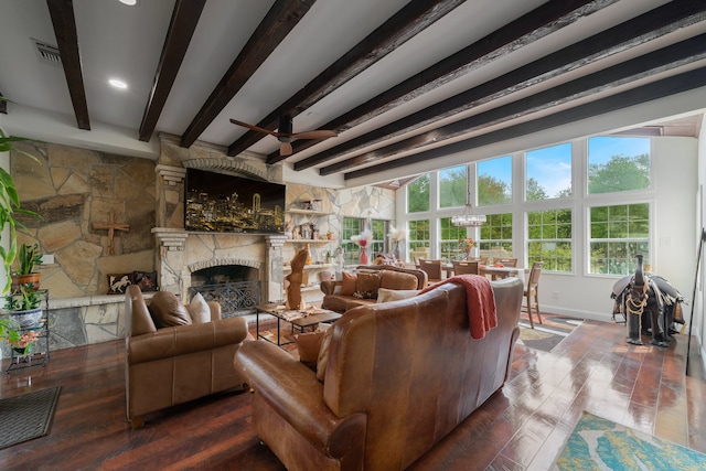 living room with a fireplace, ceiling fan, beamed ceiling, and hardwood / wood-style flooring