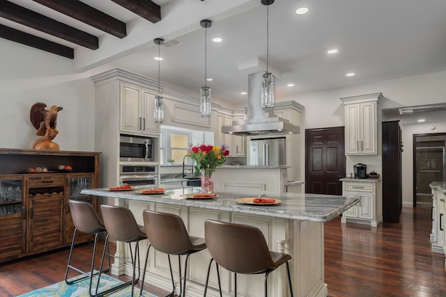 kitchen with island range hood, a large island, pendant lighting, and stainless steel appliances