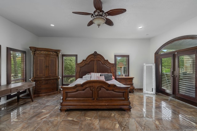 bedroom with multiple windows, access to outside, and ceiling fan