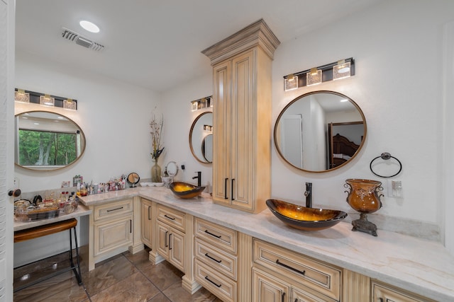 bathroom with tile patterned floors and vanity