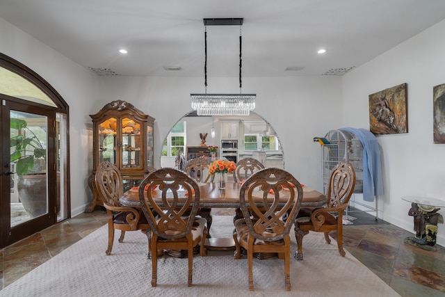 dining space featuring a chandelier