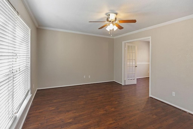 unfurnished room featuring baseboards, dark wood-style floors, ceiling fan, and crown molding