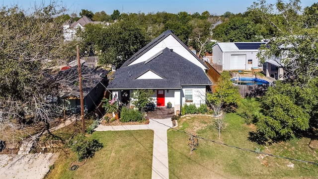 view of front facade with a front yard and a garage