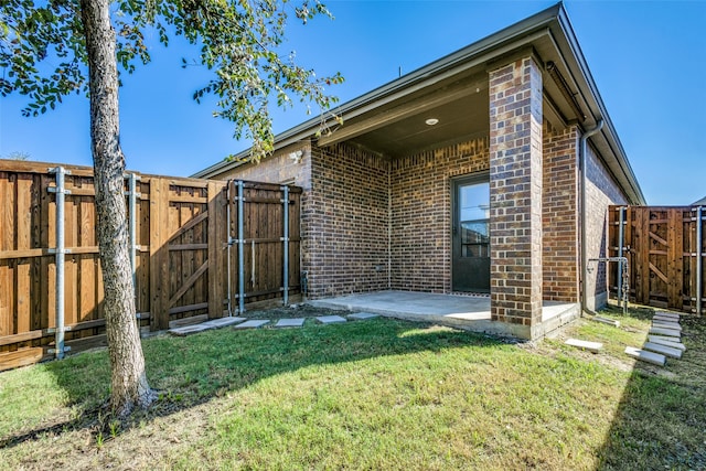 exterior space with a lawn and a patio