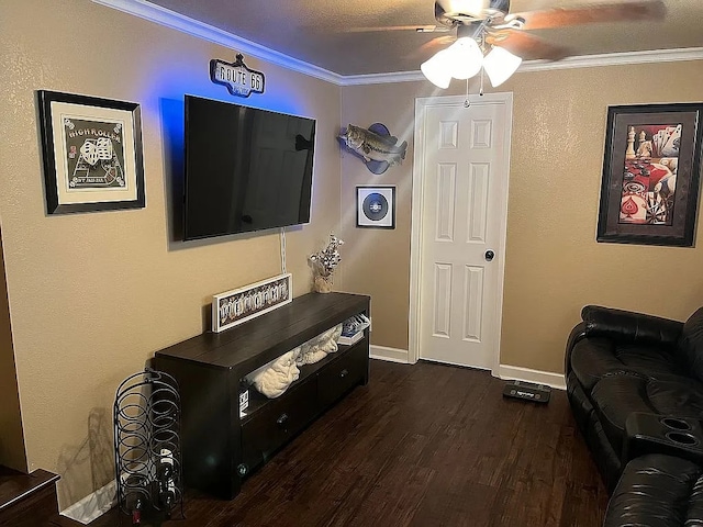 living room featuring ornamental molding, ceiling fan, and dark hardwood / wood-style flooring