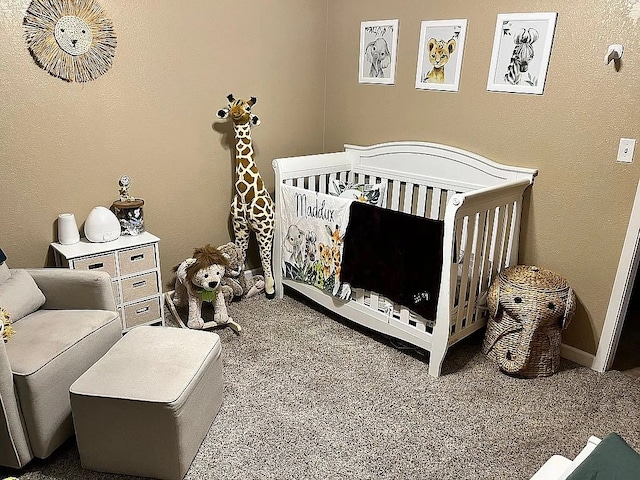 carpeted bedroom featuring a crib