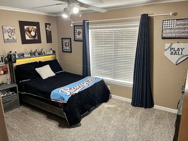 bedroom featuring carpet, ornamental molding, and ceiling fan