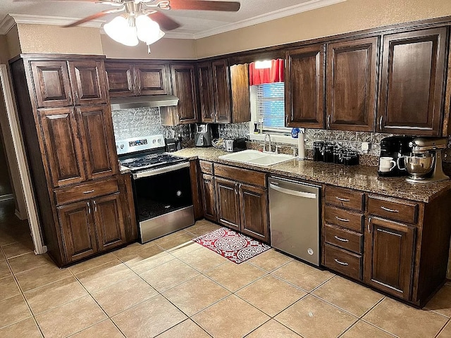 kitchen featuring light tile patterned flooring, sink, stainless steel appliances, crown molding, and decorative backsplash