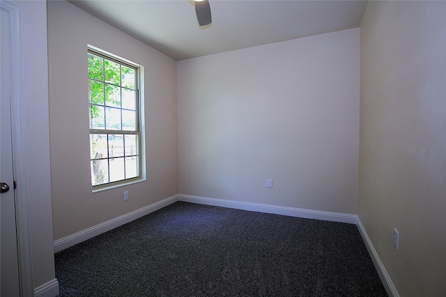 unfurnished room with ceiling fan and carpet