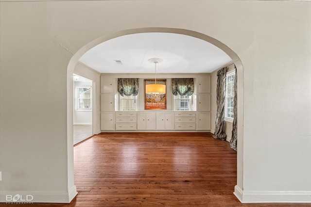 unfurnished room with dark hardwood / wood-style floors