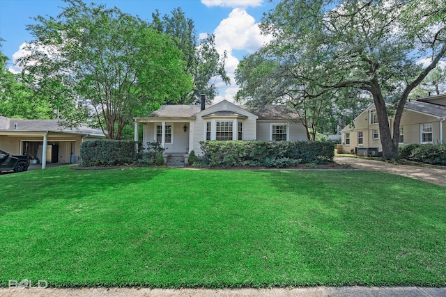 ranch-style home featuring a porch and a front yard