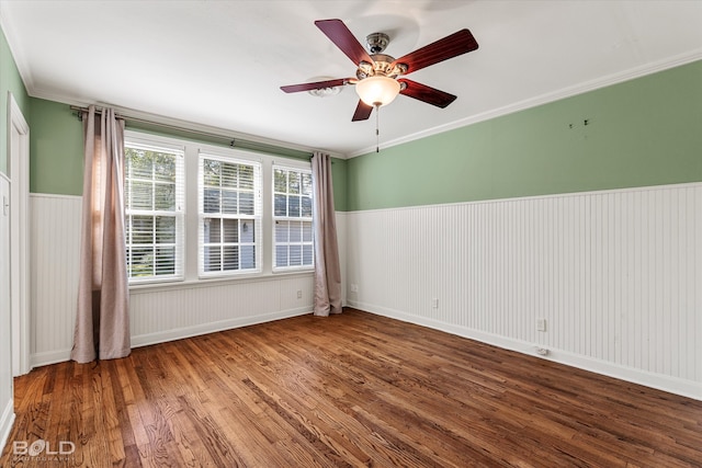 unfurnished room with ceiling fan, wood-type flooring, and ornamental molding