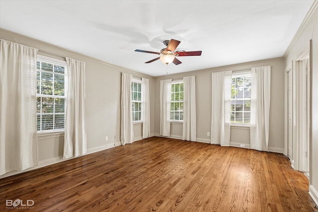 unfurnished room featuring hardwood / wood-style floors, ceiling fan, and ornamental molding