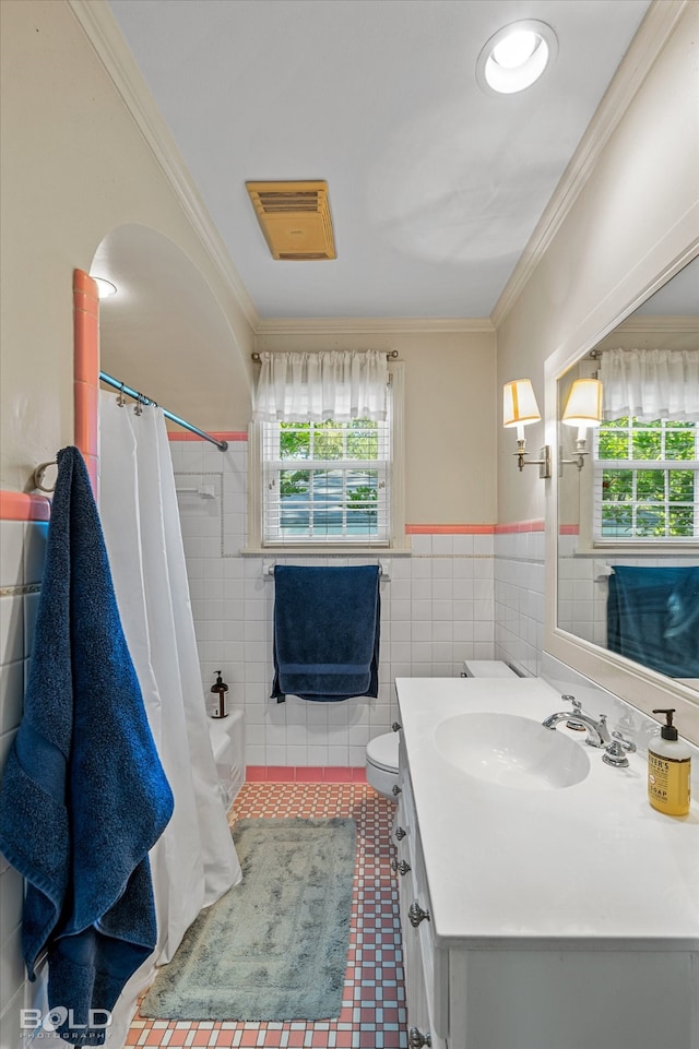 full bathroom featuring tile walls, shower / tub combo, ornamental molding, and vanity