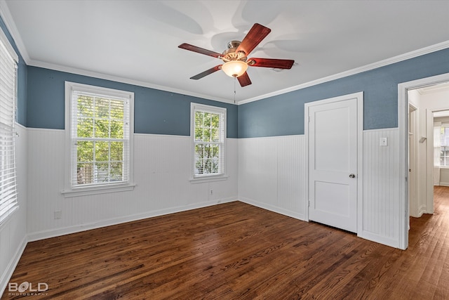 unfurnished bedroom with dark hardwood / wood-style flooring, ceiling fan, and crown molding