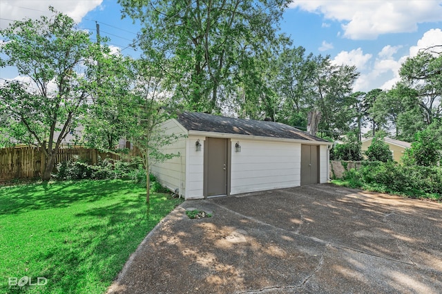 garage featuring a yard