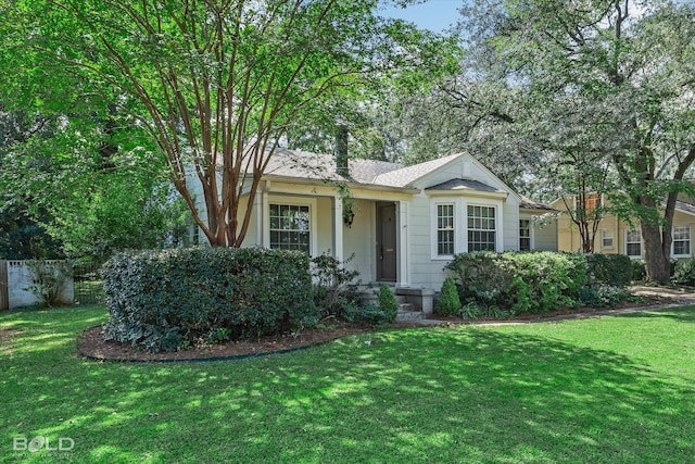 ranch-style home with a front lawn