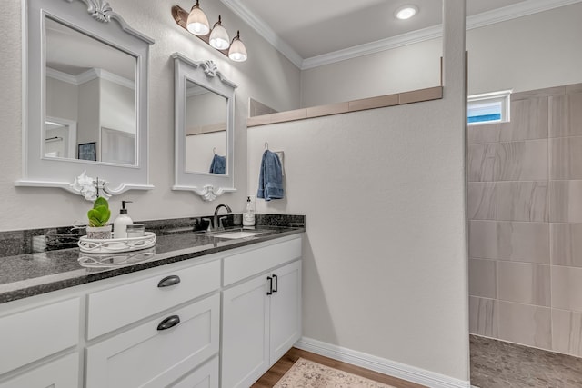 bathroom featuring vanity, crown molding, and walk in shower