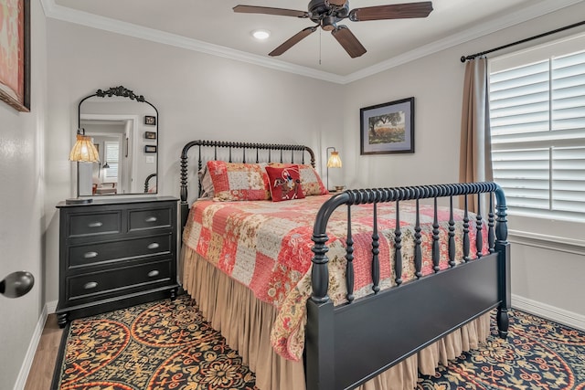 bedroom with ceiling fan, wood-type flooring, and ornamental molding