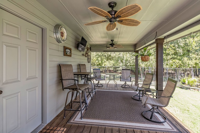 wooden deck with ceiling fan