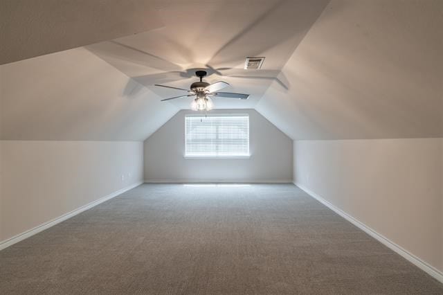 bonus room with carpet, ceiling fan, and vaulted ceiling