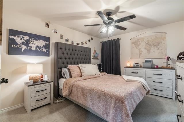 bedroom with ceiling fan and light colored carpet