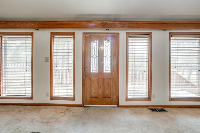 entrance foyer with light carpet