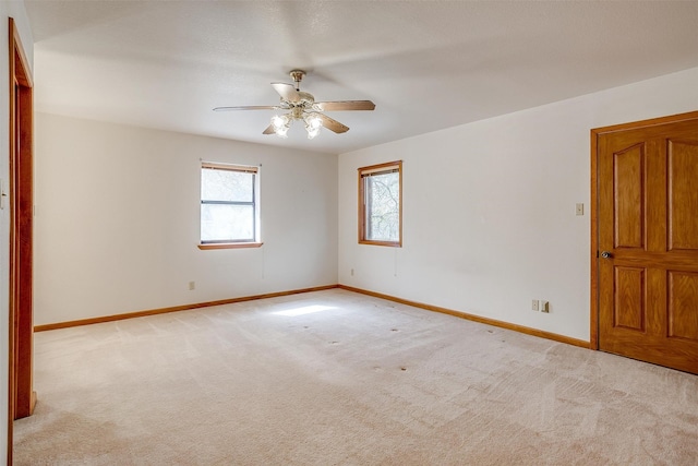 empty room with light carpet and ceiling fan