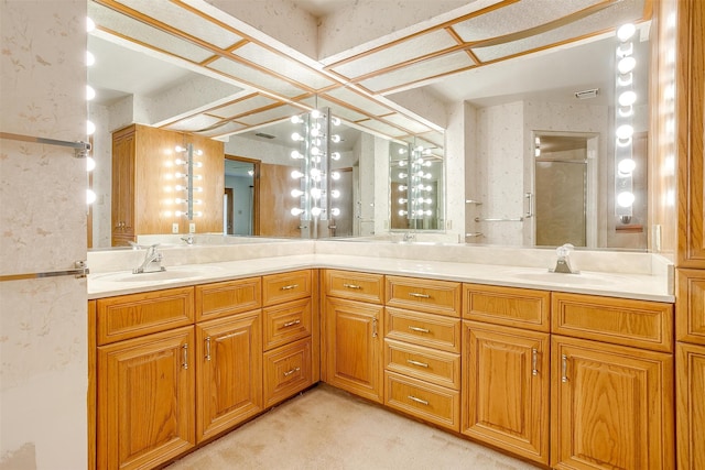 bathroom featuring walk in shower and vanity