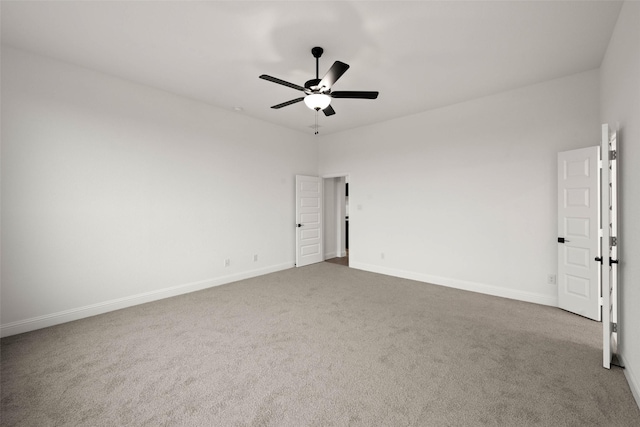 unfurnished room with ceiling fan and carpet floors