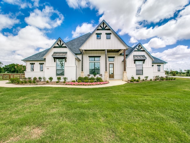 modern farmhouse with a front lawn